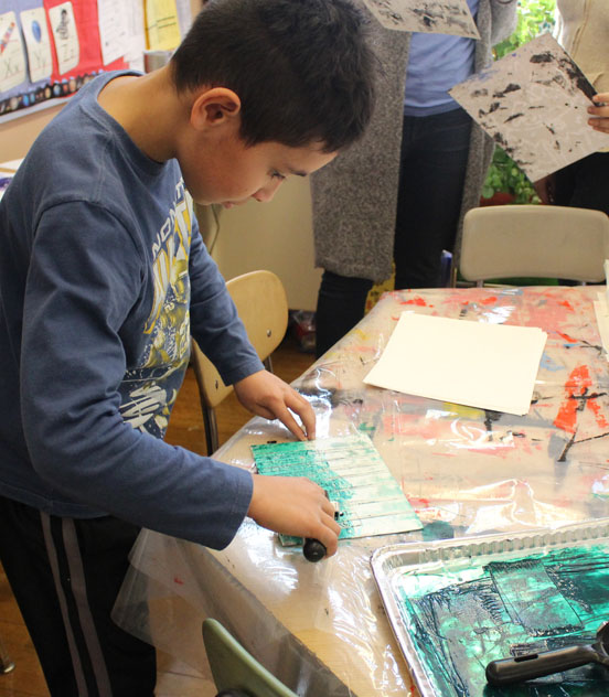 A student enjoying an art workshop